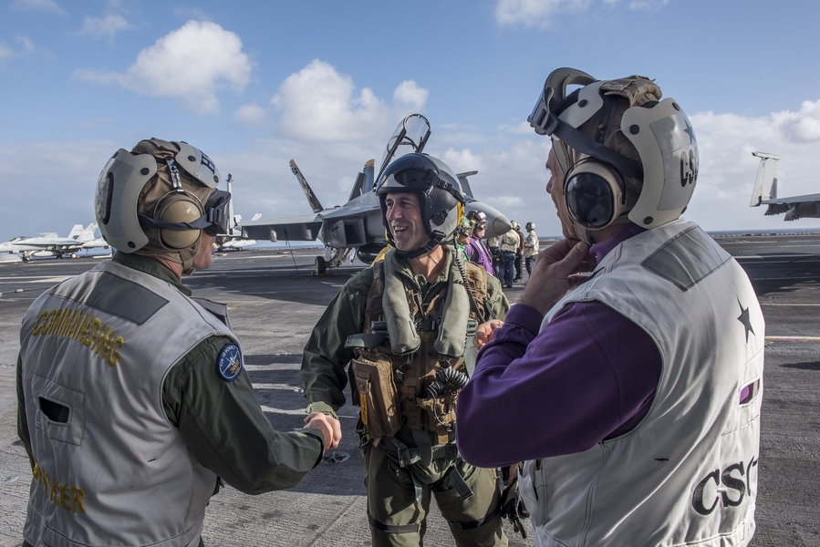 Chief of Naval Operations Admiral John Richardson SM ’89, EE ’89, ENG ’89 is greeted by Captain Ryan Scholl, commanding officer of aircraft carrier USS Harry S. Truman. Richardson envisions U.S. naval power rising as the fleet grows deeply networked with the assistance of technologies such as artificial intelligence, human and machine teams, and quantum computing.