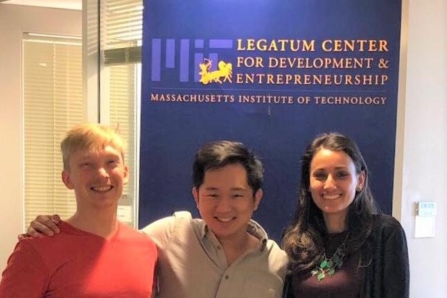 Incoming fellows Christian Ulstrup (left) and Karina Akib (right) share a moment with recent alumnus Jonathan Ng.