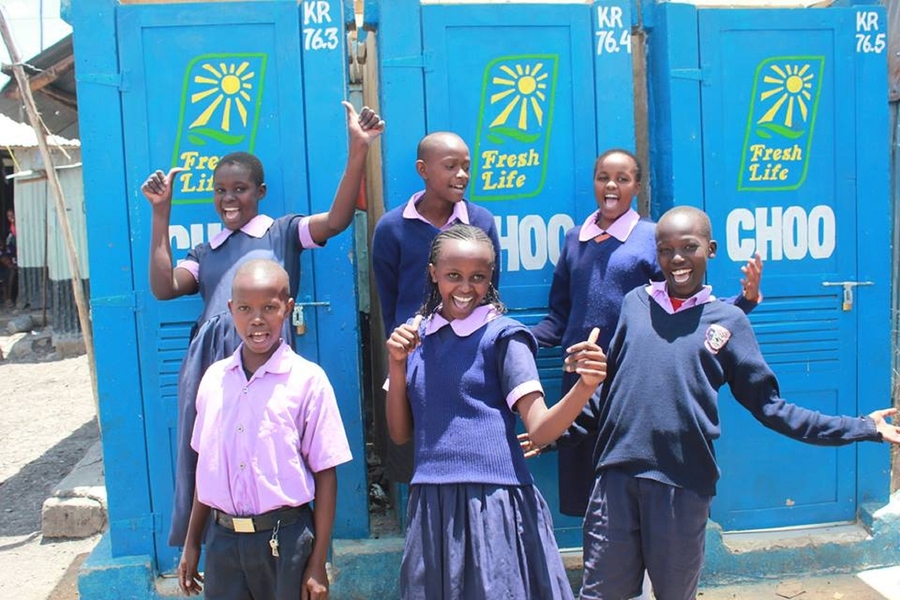 Students in Nairobi pose in front of Fresh Life Toilets built by Sanergy, a company cofounded by MIT alumni Lindsay Stradley, 2010-11 Legatum Fellow Ani Vallabhaneni, and 2011-12 Legatum Fellow David Auerbach. Sanergy brings affordable sanitation to Nairobi’s poorest neighborhoods and serves more than 60,000 customers every day.