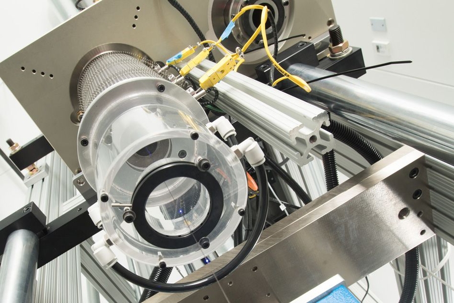 A spool of fine, soft fiber made using the new process shows the embedded LEDs turning on and off to demonstrate their functionality. The team has used similar fibers to transmit music to detector fibers, which work even when underwater.