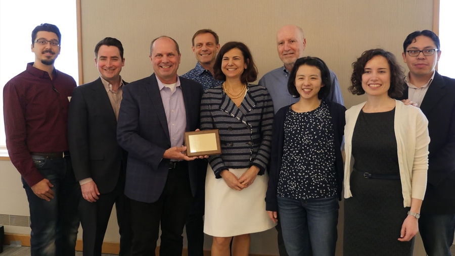 Chris Caplice, executive director of the MIT Center for Transportation and Logistics (holding plaque), received his award for his work on the MicroMasters Program in Supply Chain Management.