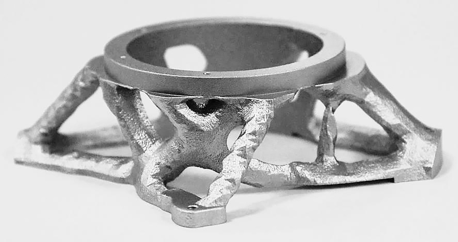 This optical mount was produced using selective laser melting. It was designed with topology optimization, which finds the best distribution of material given a set of constraints, resulting in an organic-looking structure.
