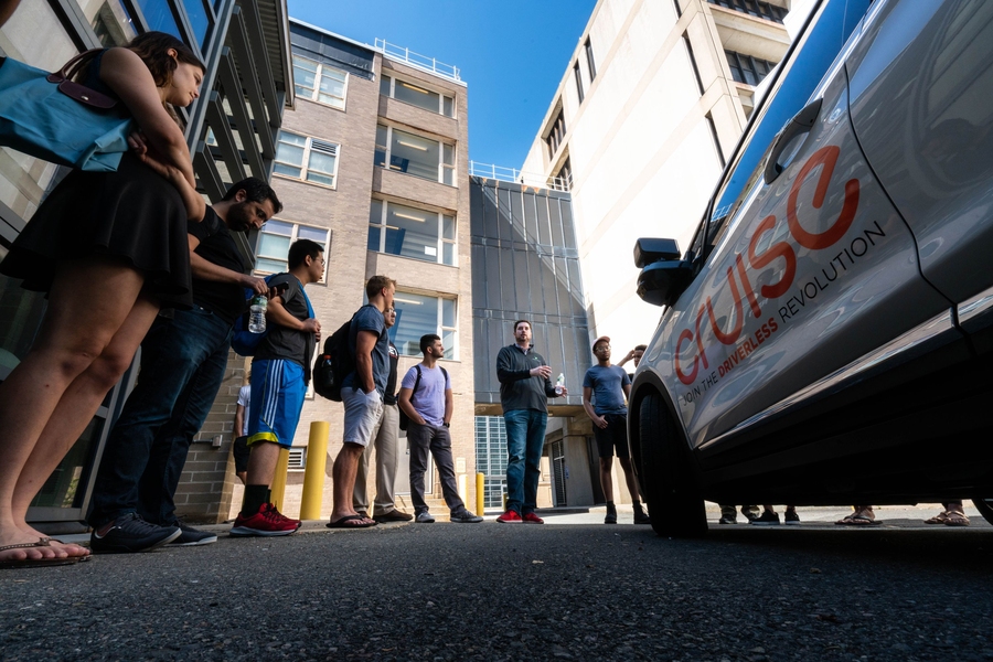 Will Dickson ’14 parked General Motors’ first self-driving vehicle, the Cruise AV, on campus and invited MIT students to think flexibly about its design opportunities. “You are future engineers and thought leaders in the area of new machines,” he said. “How do you design future vehicles like this one better for a safe and autonomous experience?”