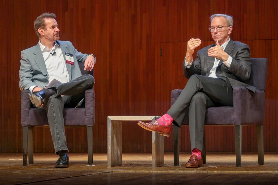 MIT professor Erik Brynjolfsson (left) talks with former Google chairman Eric Schmidt at the opening fireside chat.