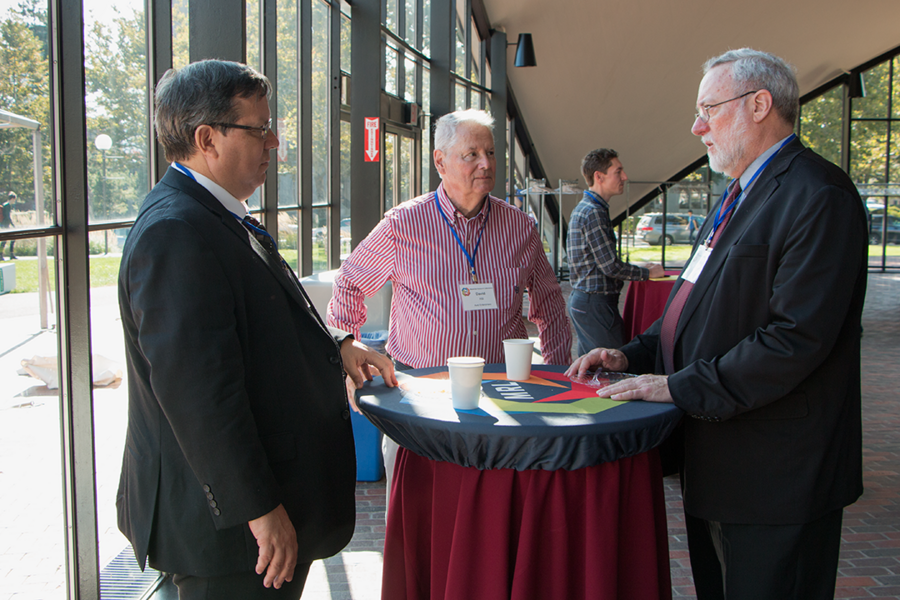 BP Amoco Chemical Company Senior Research Chemist Matthew Kulzick (left) speaks with David Hill of Avid Enterprises and Materials Research Laboratory Director Carl V. Thompson during a break at MIT MRL Materials Day Symposium on Oct. 10.