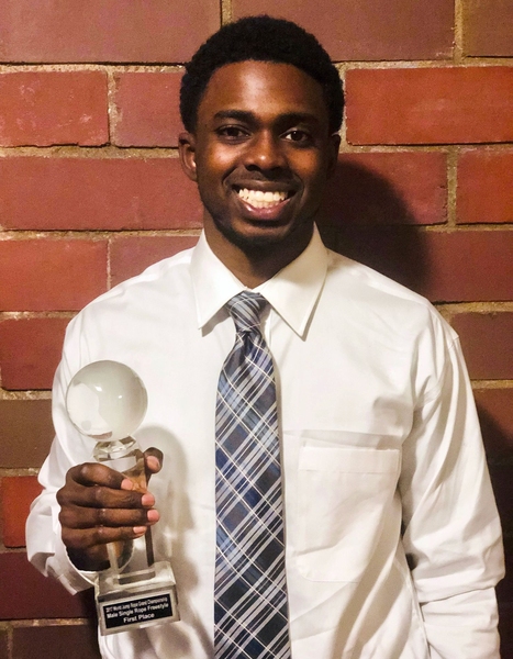Stewart Isaacs holds his 2017 Grand World Championship trophy for Single Rope Freestyle.
