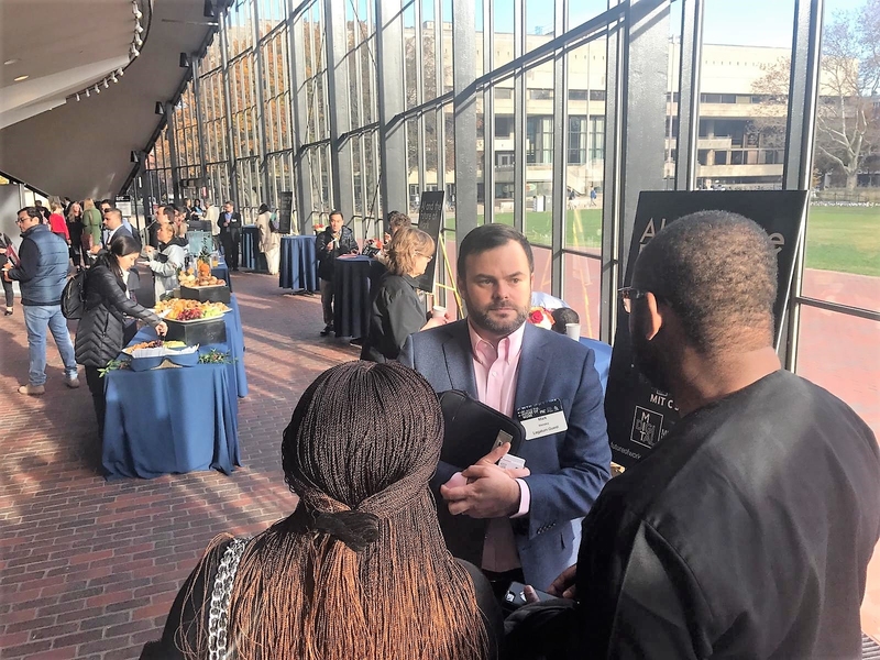Mark Wensley from Mastercard Foundation talks to RecyclePoints cofounders Chioma Ukonu (left) and Mazi Ukonu (right) at breakfast reception before the Future of Work Congress.