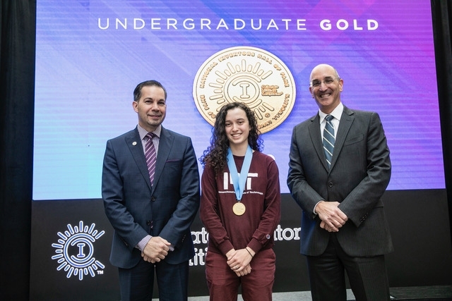 Elizabeth Bianchini ’18 (center) accepts gold in the Undergraduate Category at the Collegiate Inventors Competition last month for Rhino, a product first developed in 2.009 (Product Engineering Processes). Bianchini was joined on stage by Tony Scardino (left), chief financial officer of the U.S. Patent and Trademark Office, and Drew Hirshfeld, commissioner for patents for the U.S. Patent and Tra...