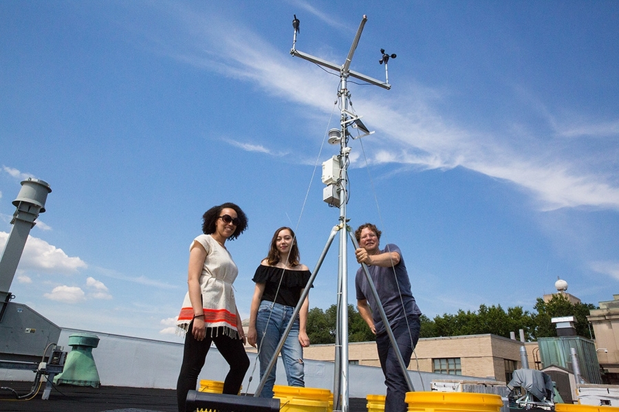 MIT graduate student Alpha Yacob Arsano (left), Wellesley College senior Chloe Blazey (center), and MIT principal investigator and professor of architecture Christoph Reinhart pose with a weather station they use to gather data that will help them develop software for evaluating the performance of energy-efficient buildings in different climates.