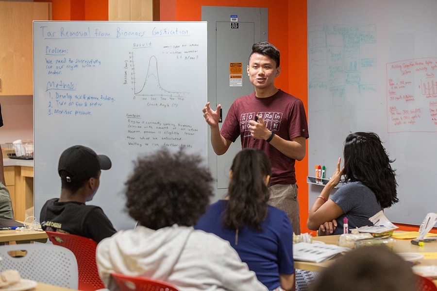MIT sophomore Jimmy Tran practices his research poster presentation during a workshop session on scientific communication. Tran is working with Leslie Bromberg of the Plasma Science and Fusion Center and Emmanuel Kasseris of the Department of Mechanical Engineering to remove tar from biomass-generated gases. The engine they’re developing could make biomass gasification a clean and reliable sourc...