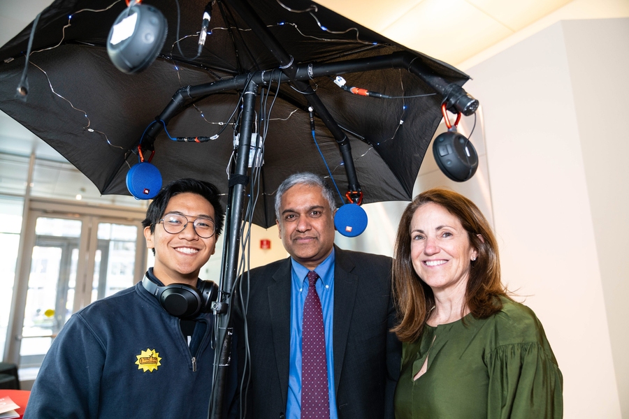 Russel Pasetes (left), a third-year electrical engineering and computer science student, describes the MIT Spatial Sound Lab, a project that uses new computing technology and cutting-edge speakers to create spatially mixed surround sound, to Dean of Engineering Anantha Chandrakasan (center) and Chancellor Cynthia Barnhart. 