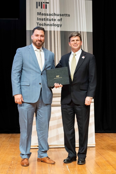 Chris Budny receives an Outstanding Contributor award from Lincoln Laboratory Assistant Director for Operations Scott Anderson.