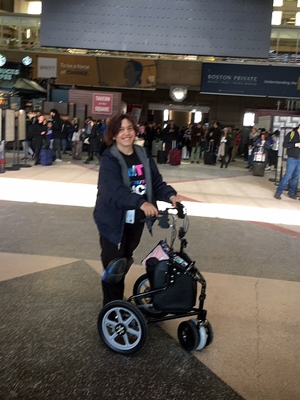 Lora Brugnaro navigates North Station with her improved walker.