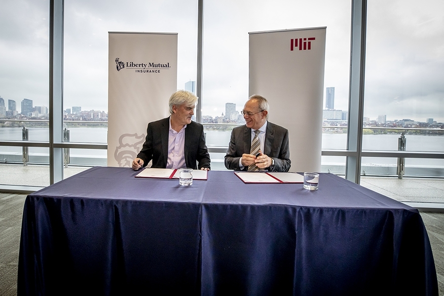 MIT and Liberty Mutual Insurance announced a $25 million, five-year collaboration to support intelligence research at a meeting on Tuesday attended by Liberty Mutual Chairman and CEO David Long (left) and MIT President L. Rafael Reif.
