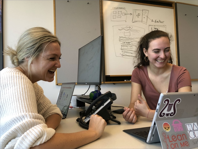 MIT Quest for Intelligence-sponsored UROP projects this spring included a focus on developing AI tools for all. Here, Katherine Gallagher (left), a software engineer with the Quest Bridge, offers advice to sophomore Maya Nigrin, who is helping to build an extension to the coding platform Scratch to introduce kids to generative models.  