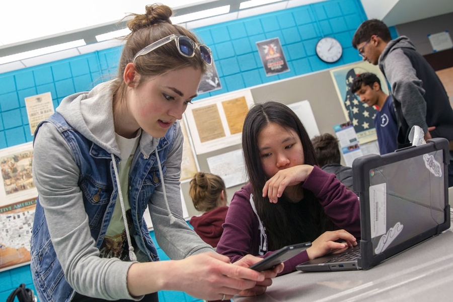 MIT PhD student Jess V works with Cambridge Rindge and Latin student on App Inventor.