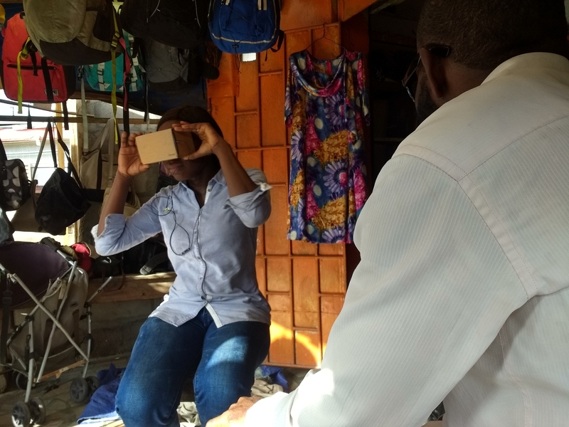 A survey team led by grad student Andrew Miller displays use of the virtual reality equipment, which helped elicit feedback on providing information about crimes in Lagos, Nigeria.