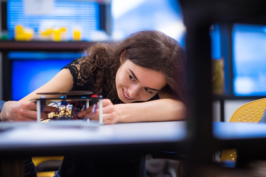 Terryn Brunelle prepares her 6.08 team’s project DJam — which offers an interconnected twist on "Guitar Hero" — for an in-class demo.