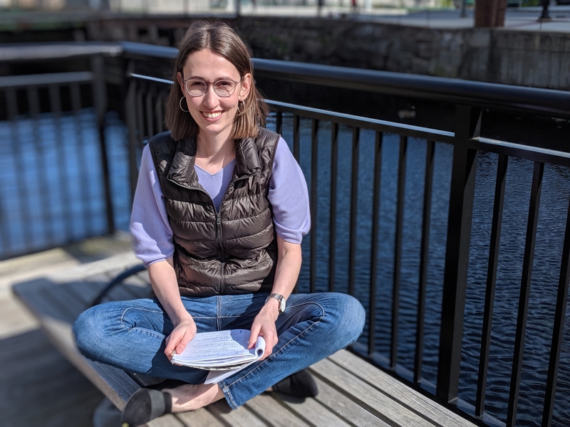 2018-19 J-WAFS Fellow Andrea Beck sits by the Charles River.