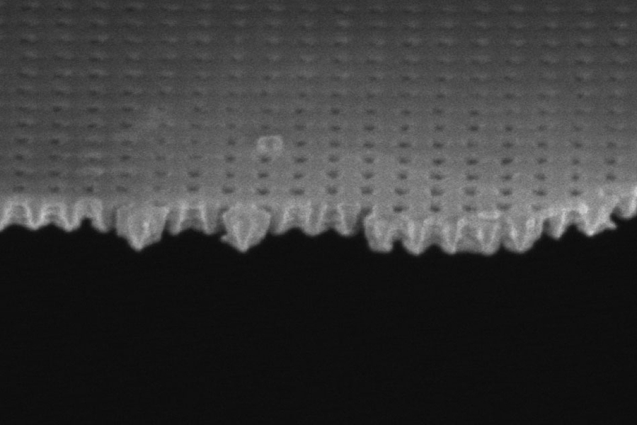 A scanning electron microscope image shows the thin membrane used in these experiments, with holes just 100 nanometers across. The membrane was used to both heat the liquid and measure its temperature upon evaporation.