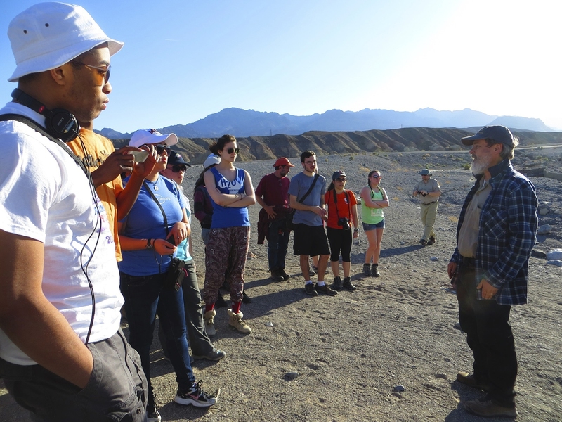 Sam Bowring (right) teaches on a Terrascope field trip to southern California and Nevada in 2013, where students learned about sustainable extraction and use of strategic minerals by visiting lithium, boron, and pegmatite mines, and other sites of geological significance.