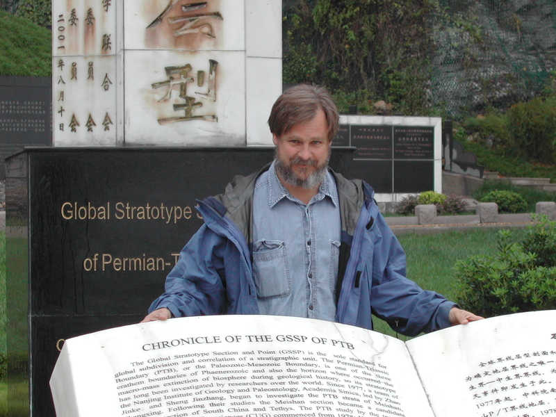 Sam Bowring stands at the ceremonial Permian-Triassic boundary marker at the Changxing Geopark in Meishan, Zhejiang Province, southern China, where the rock record preserves evidence of the Earth’s greatest mass extinction event which occurred 252 million years ago.
