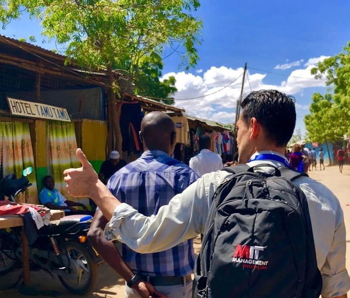 Sergio Medina (right) heads to the Kakuma Refugee Camp in Kenya, where his venture is using technology solutions to accelerate the delivery of humanitarian aid.
