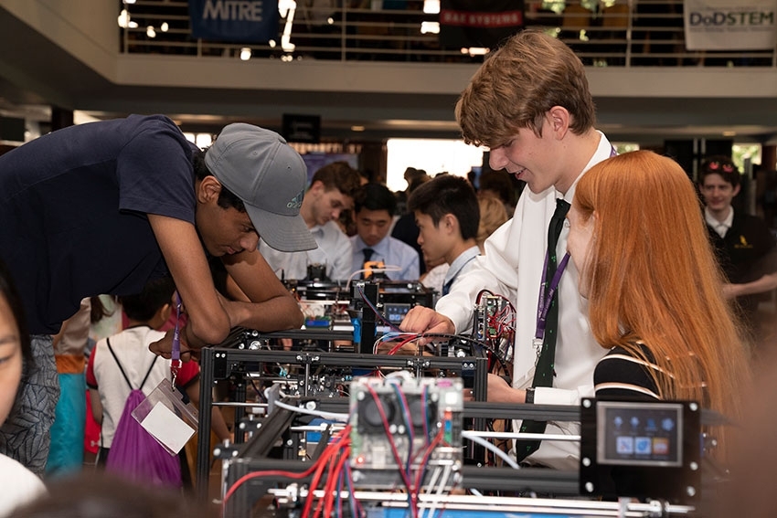 Students from the Hacking a 3-D Printer course display their work to visitors in the MIT Stratton Student Center.