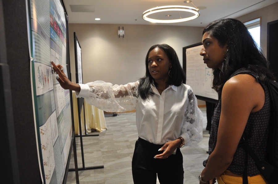 At the end-of-summer poster session, 2019 MSRP student Kiana Williams from Drexel University presents her research on the mechanism of allosteric-specificity regulation in human ribonucleotide reductase, which she carried in the lab of biology and chemistry Professor Cathy Drennan.