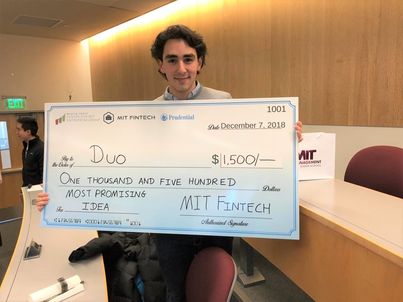 Luis Torres displays an MIT Fintech prize for his venture DUO (cofounded with Hugo Lopez), which is developing a management dashboard and corporate card for small and medium businesses in Mexico.