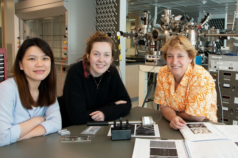 Left to right: Postdoc Shu Fen Tan, graduate student Kate Reidy, and Professor Frances Ross, all of the Department of Materials Science and Engineering, sit in front of a high vacuum evaporator system. The equipment was housed temporarily in MIT.nano while Ross’s lab was built out in Building 13.