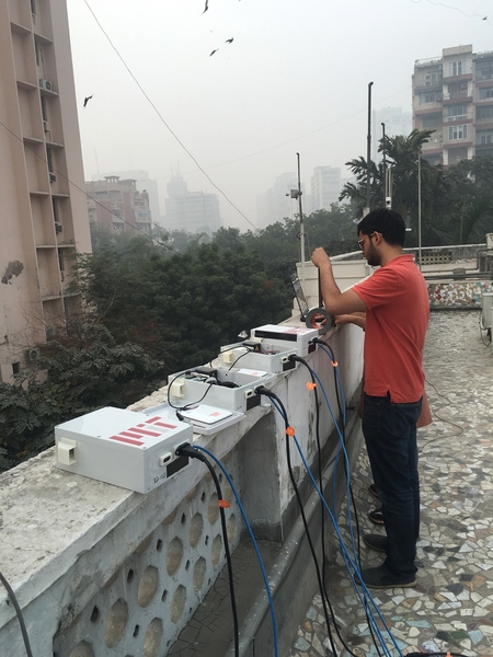 Graduate student Sidhant Pai repairs low-cost air quality sensors near Connaught Place in Central Delhi.