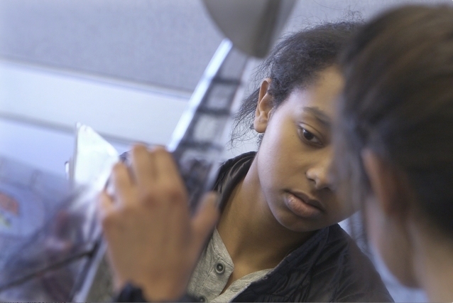 Naomi Michael examines a bird plane brought to class by Frey to use as a reference for her team's final project.