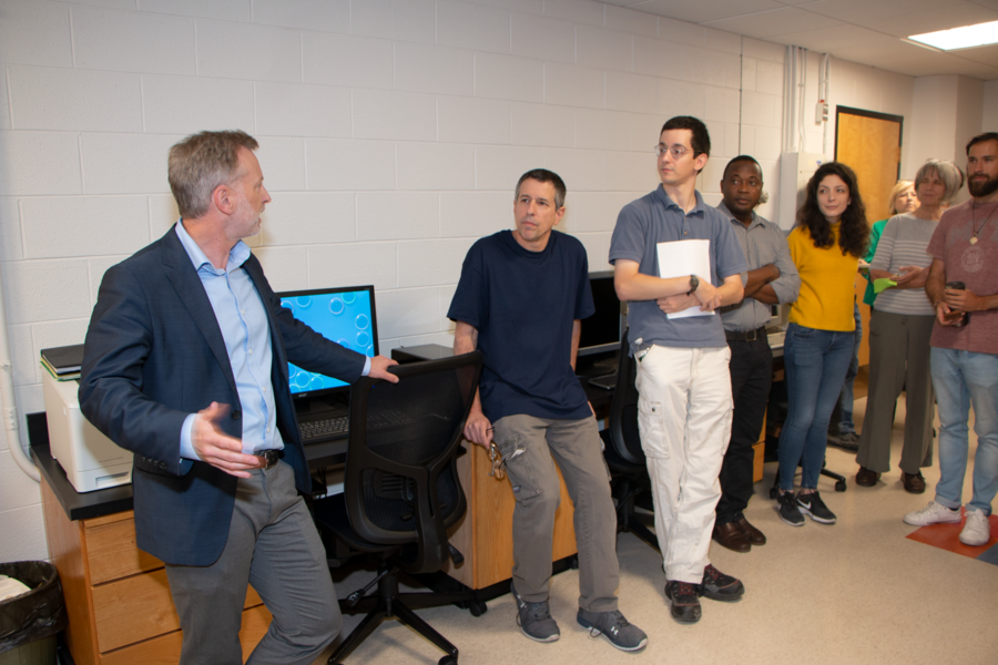 Materials Research Laboratory Co-Director Geoffrey Beach (left) welcomes visitors to an event celebrating renovations to the electron microscopy suite in MIT's Building 13.