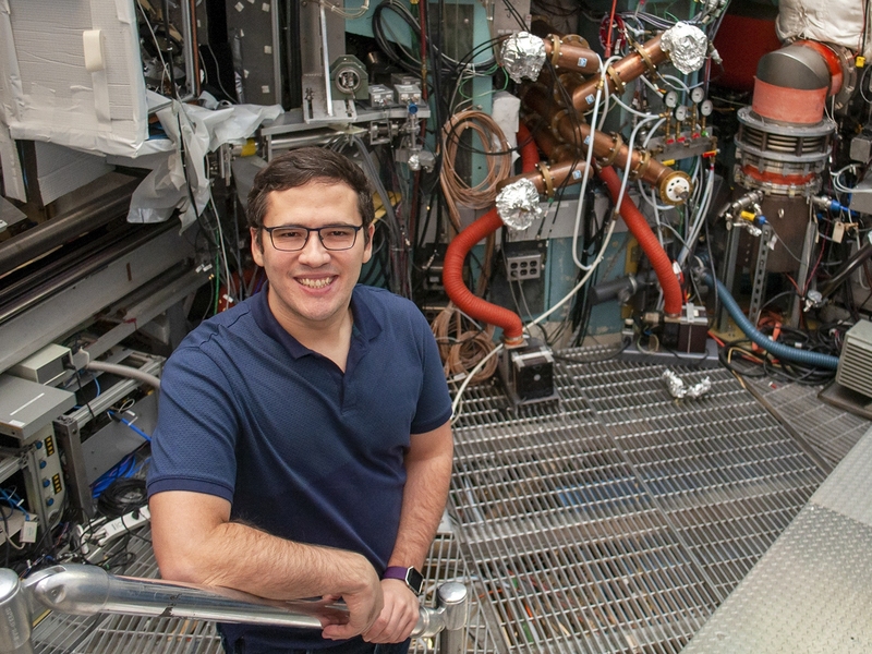 For his prize-winning thesis, Pablo Rodriguez-Fernandez examined data from MIT's Alcator C-Mod tokamak (background).