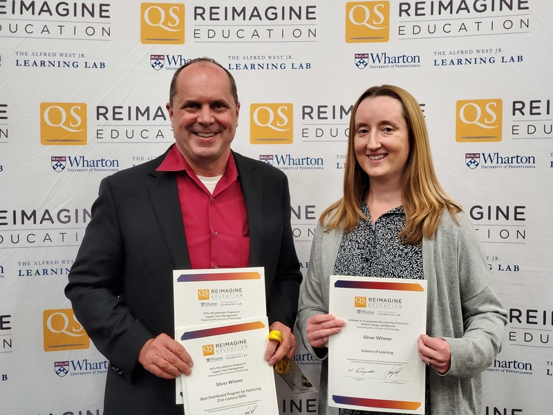 Chris Caplice (left), director of the MicroMasters Program in Supply Chain Management, and Mary Ellen Wiltrout, lecturer in digital learning for biology, receive awards for educational innovation at the QS Reimagine Education Awards. 