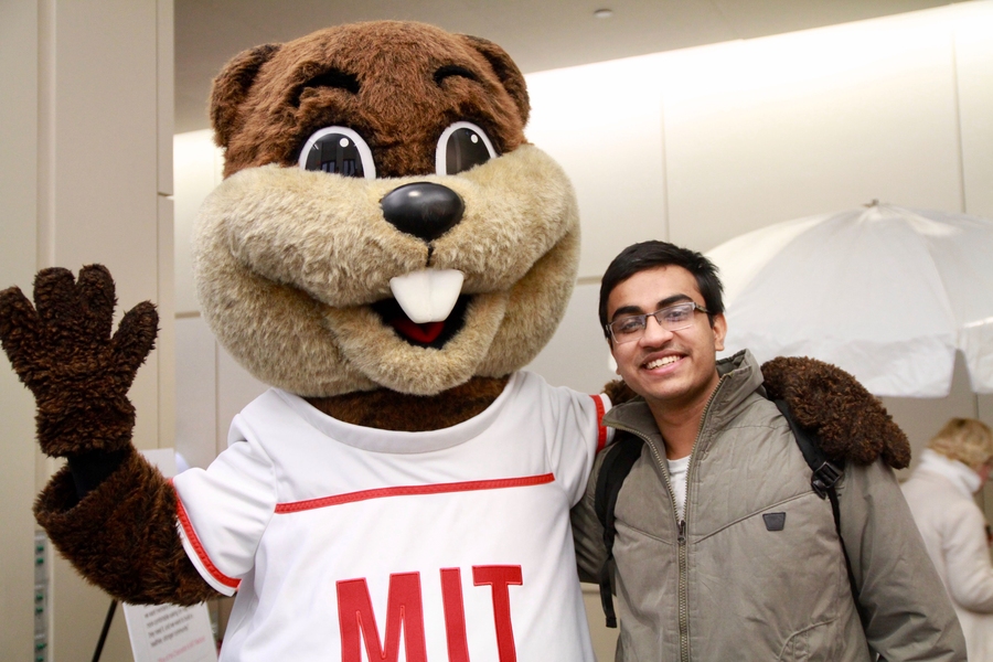Tim the Beaver takes photos with members of the community at MindHandHeart's 4th birthday celebration.