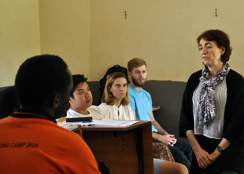 Right to Left: MIT professor of biology and director of MIT-Africa Hazel Sive and MIT students Michael Ren, Violet Felt, and Sean Elliott speak at the MISTI-Africa IMO training camp in Uganda.