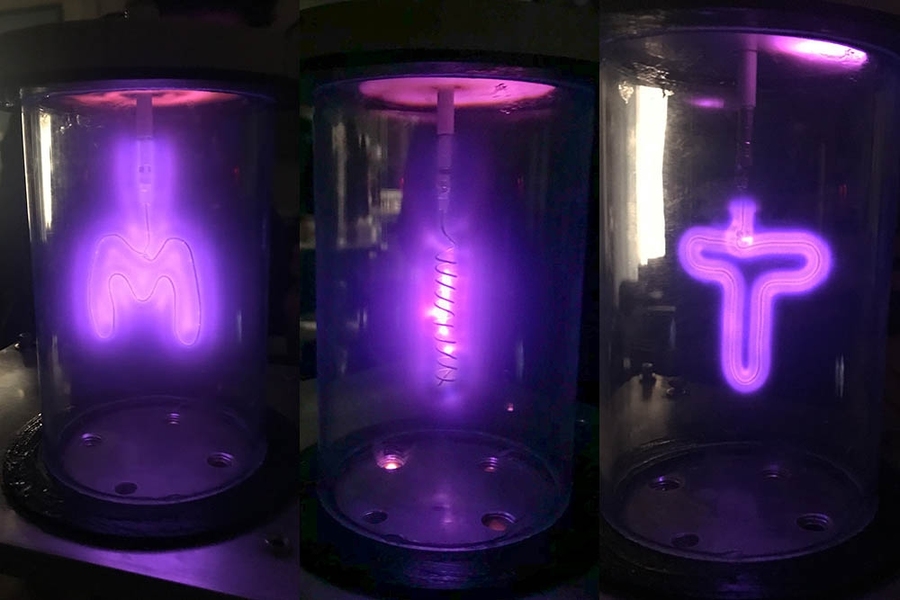 At an IAP workshop in the new nuclear makerspace, "MIT Nucleus," participants created fusors, devices that use an electric field to accelerate ions to energies high enough to fuse nuclei, giving off a purple glow. First-year Lilly Edwards and MIT staff member Ben Holt teamed up to create this glowing "MIT."