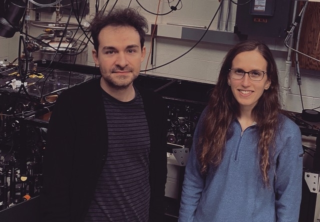 Edoardo Baldini (left) and Carina Belvin work in the Gedik lab at MIT. The researchers used ultrafast lasers in the extreme infrared for their magnetite discovery.
