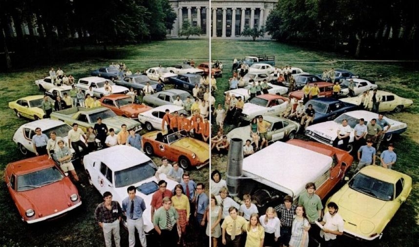 Participants of the Clean Air Car Race stand in front of their cars in Killian Court