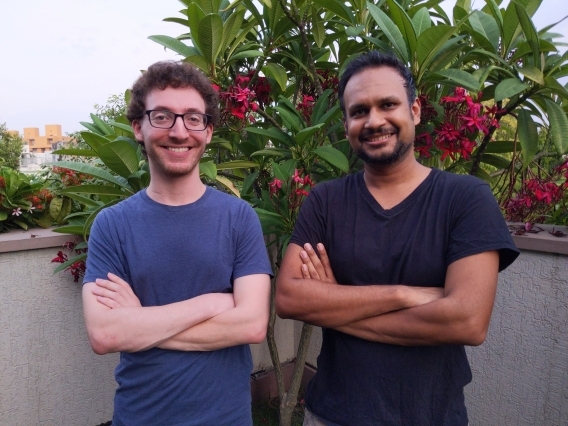 Two men standing side by side