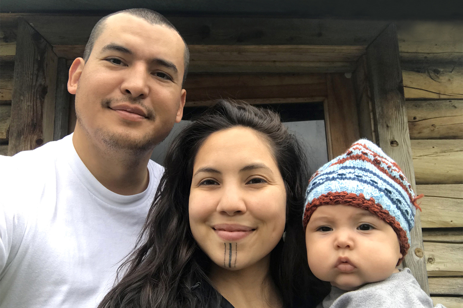 Photo of Annauk Olin with her husband and baby boy