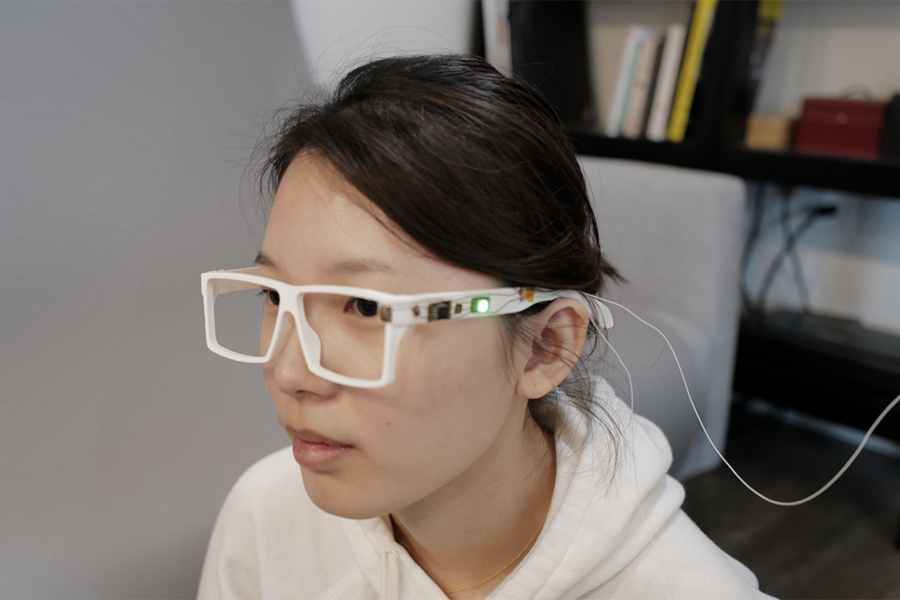 Photo of a woman wearing experimental eyeglasses