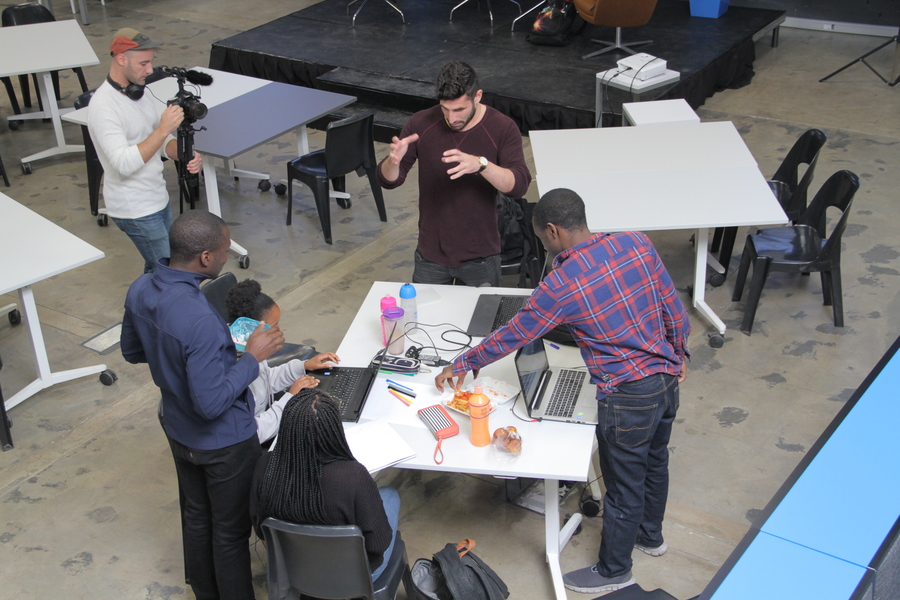 Photo of a group of students working together around a table