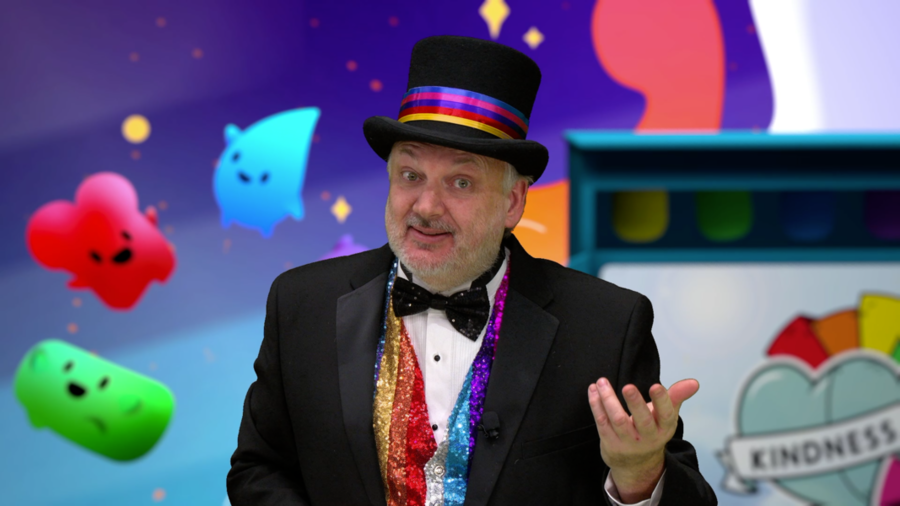 Photo of David Wallace dressed in a top hat, presenting during webcast