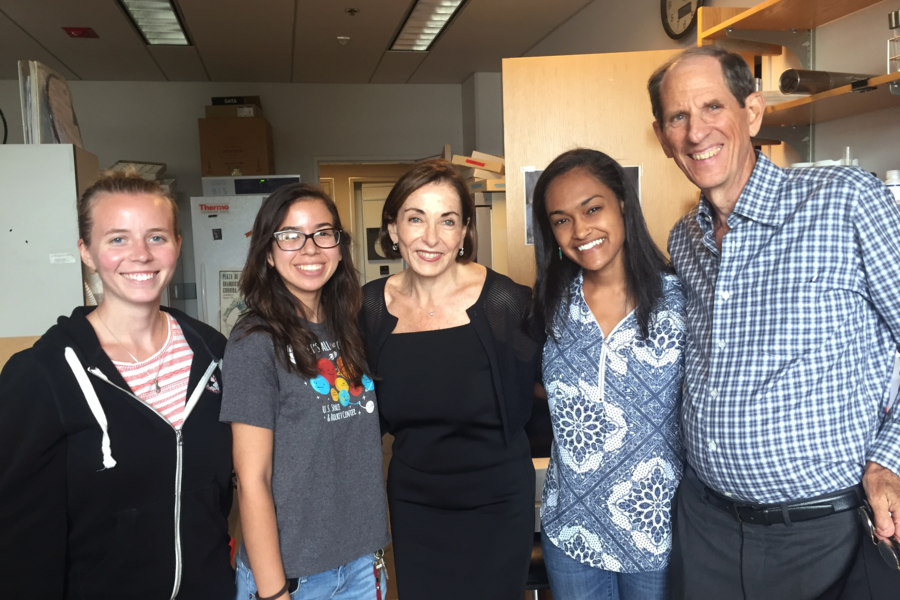 Photo of five people in a lab