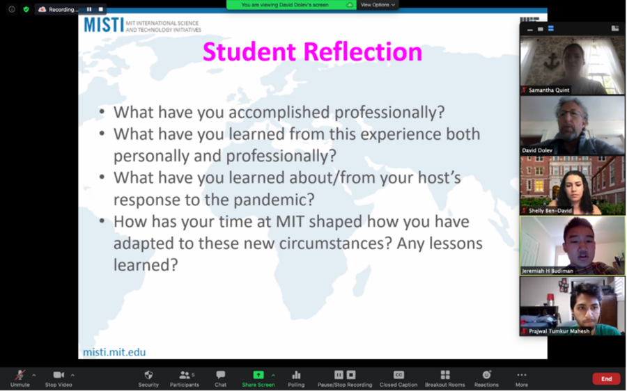 Screenshot of five people in a Zoom meeting watching a slideshow
