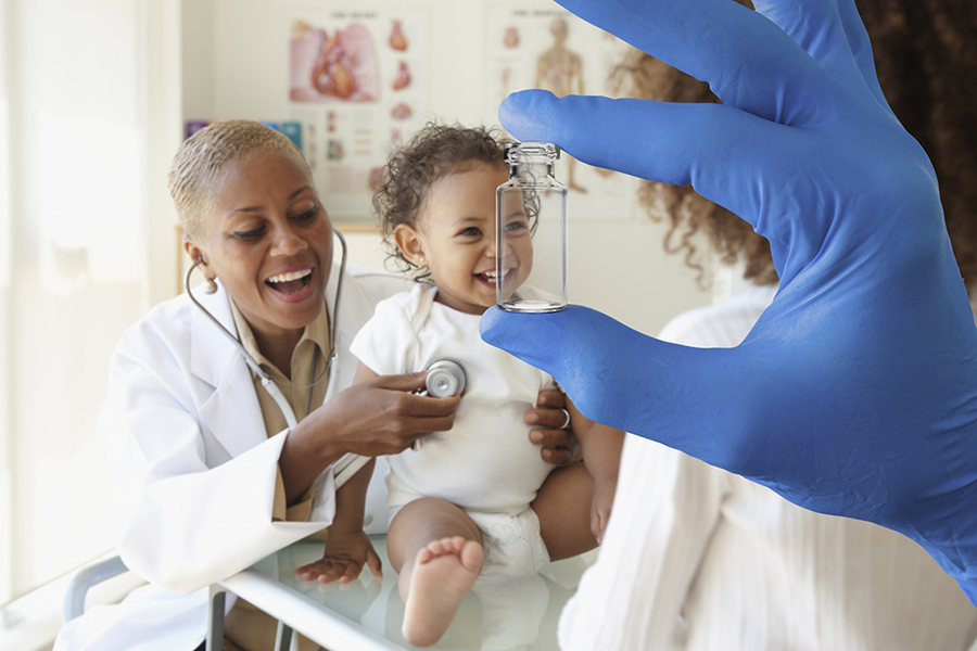 Photo of a gloved hand holding a glass vial. In the background, a doctor examines a happy baby.