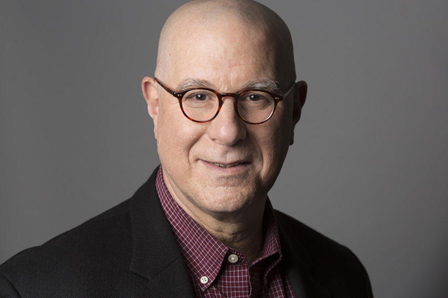 Portrait photo of Richard Samuels against a neutral gray background